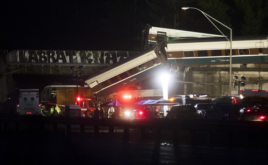 The scene of an Amtrak derailment over Interstate 5 taken in the evening on Monday, December 18, 2017 from Mounts Road.