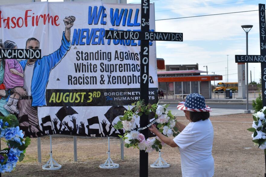  Patricia Benavidez adjusts a floral arrangement at a memorial that honors her husband, Arturo Benavidez, who was killed at an El Paso Walmart in 2019.