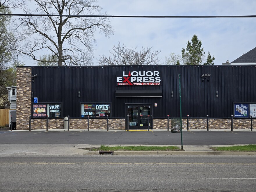Liquor Express store advertising beer, wine and ATM and lottery tickets.