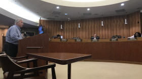 Hollywood resident Joseph Mickey pleads with Broward County Commissioners Tuesday not to put up a 911 radio tower in West Lake Park.