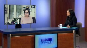 Show host talks to guest over Zoom.