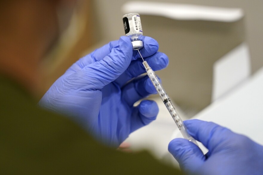 The Guilford County Division of Public Health is now offering COVID-19 and flu vaccine appointments for residents. (AP Photo/Lynne Sladky)