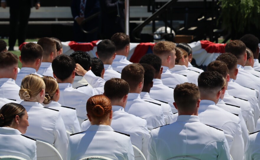 Newly commissioned officers celebrate graduation at the U.S. Coast Guard Academy in New London.