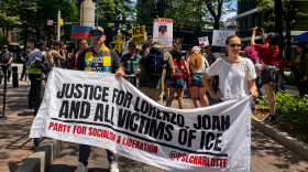 Protesters march through uptown Charlotte on July 18, 2026, during a demonstration calling for an end to U.S. Immigration and Customs Enforcement and justice for people killed during recent immigration operations.