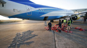 Personal belongings of immigrants who entered the United States illegally are loaded onto a plane for a deportation flight to El Salvador by U.S. Immigration and Customs Enforcement Friday, Nov. 16, 2018, in Houston. 