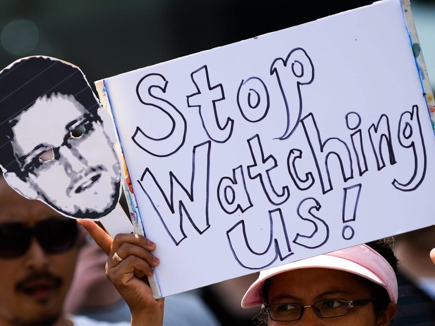 Protesters in Hanover, Germany, hold placards amid hundreds of demonstrators protesting the surveillance programs of the U.S. National Security Agency in July.