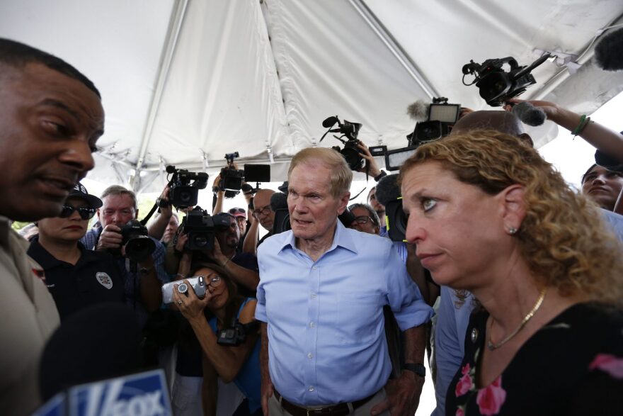 U.S. Sen. Bill Nelson, center, and congresswoman Debbie Wasserman Schultz, right, were denied entry by security into the Homestead Temporary Shelter for Unaccompanied Children on Tuesday. (AP Photo/Brynn Anderson)