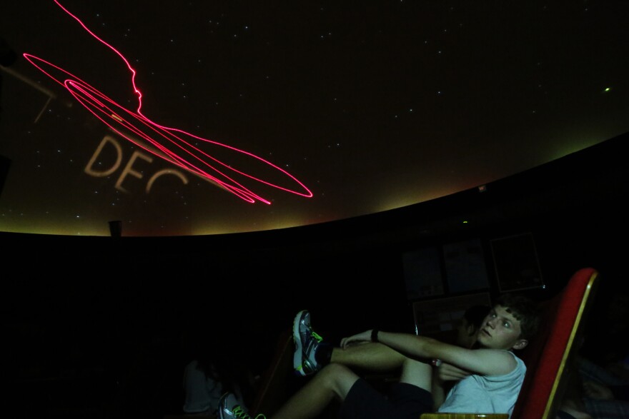 Jasper Barnett, a junior at Thomas Jefferson High School for Science and Technology in Alexandria, Va., looks up in the school's planetarium.