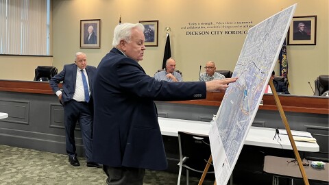 Dickson City Solicitor Bill Jones, standing left, questions borough planner Tom Shepstone during a zoning board hearing on an appeal by a data center developer to the borough's data center ordinance.