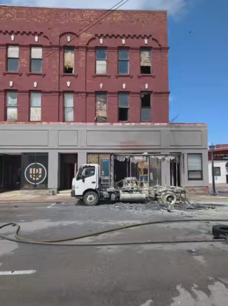 A mobile billboard truck caused severe damage to Retro Attics Studio, a local business in Bay City, after being engulfed in flames outside of the storefront in April 2026.