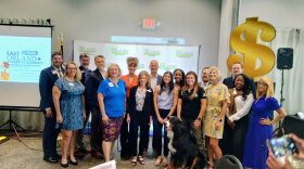 Group of people pose for photo at the East Orlando Chamber of Commerce Luncheon