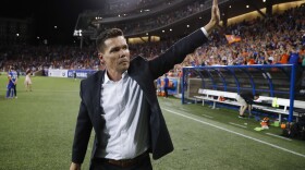 FC Cincinnati head coach Alan Koch waves to the crowd after winning a U.S. Open Cup soccer match against the Chicago Fire in June 2017 in Cincinnati. 