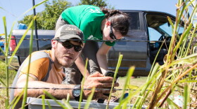 Researchers Nate Stevens and Hannah Rabinowitz calibrating a seismometer near Pawnee, Okla.