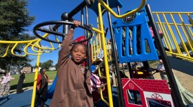 Students at Ford Academic Center enjoy on new inclusive playground equipment