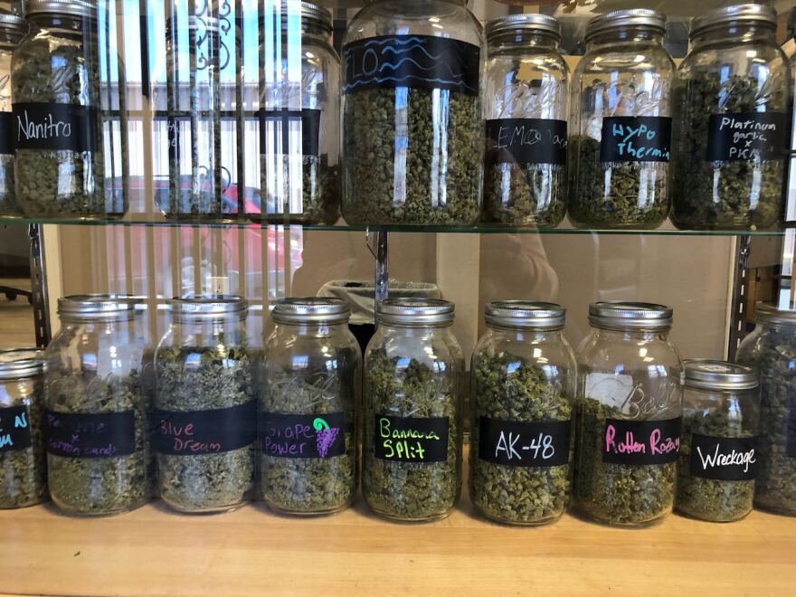 Jars of cannabis with names like Banana Split, AK-48 and Wreckage