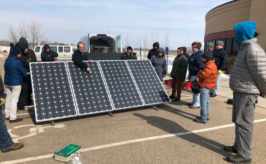Students with a big panel