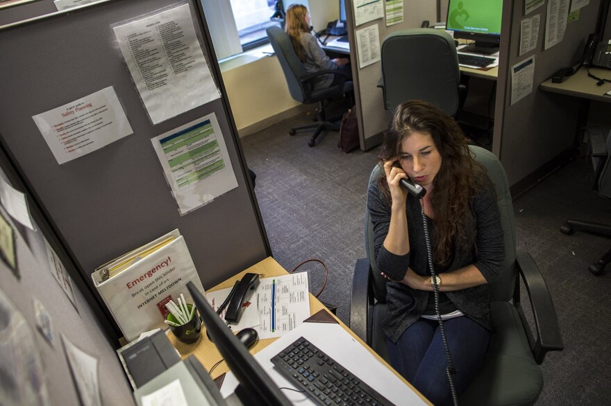  A volunteer speaks with a caller on the Samaritans hotline. 