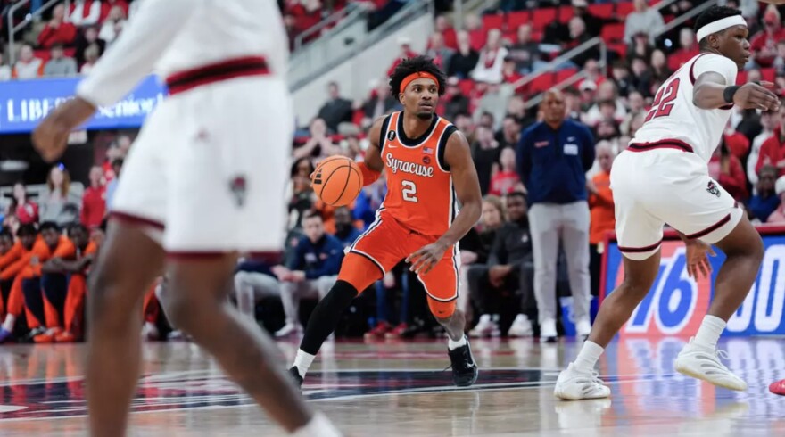 JJ Starling (2, Orange) dribbles towards the basket for a shot against NC State on Tuesday in Raleigh.