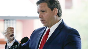 Florida Gov. Ron DeSantis speaks at a news conference at Universal Studios Wednesday, June 3, 2020, in Orlando, Fla. The Universal Studios theme park reopened today for season pass holders and will open to the general public on Friday. Bars and theme parks will be part of Florida's Phase 2 reopening after closure due to the coronavirus pandemic. (AP Photo/John Raoux)