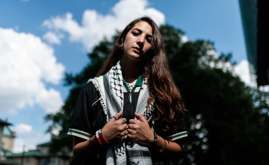 Recent Virginia Commonwealth University graduate Sereen Haddad poses for a photograph outside VCU's Cabell Library on Monday, June 30, 2025. The university is withholding Haddad's degree over her involvement in a pro-Palestinian demonstration in April.