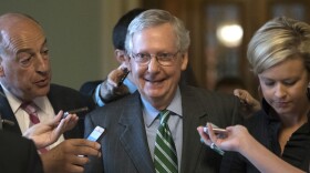FILE: Senate Majority leader Mitch McConnell smiles as he leaves the chamber after announcing the release of the Republicans' health care bill Thursday, June 22, 2017.