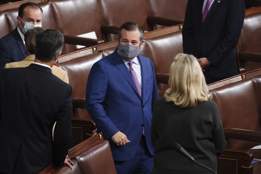 Sen. Ted Cruz, R-Texas, arrives as a joint session of the House and Senate convenes to confirm the Electoral College votes cast in November's election, at the Capitol in Washington, Wednesday, Jan. 6, 2021.