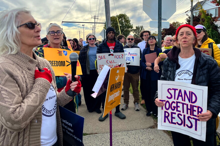 Members of the New Haven Singing Resistance give voice to a song with the lyrics, ”Our love for each other will carry us through. Yes it will," outside Tweed-New Haven Airport October 21, 2026 with members of the New Haven Immigrant Coalition and other pro-immigrant advocates.