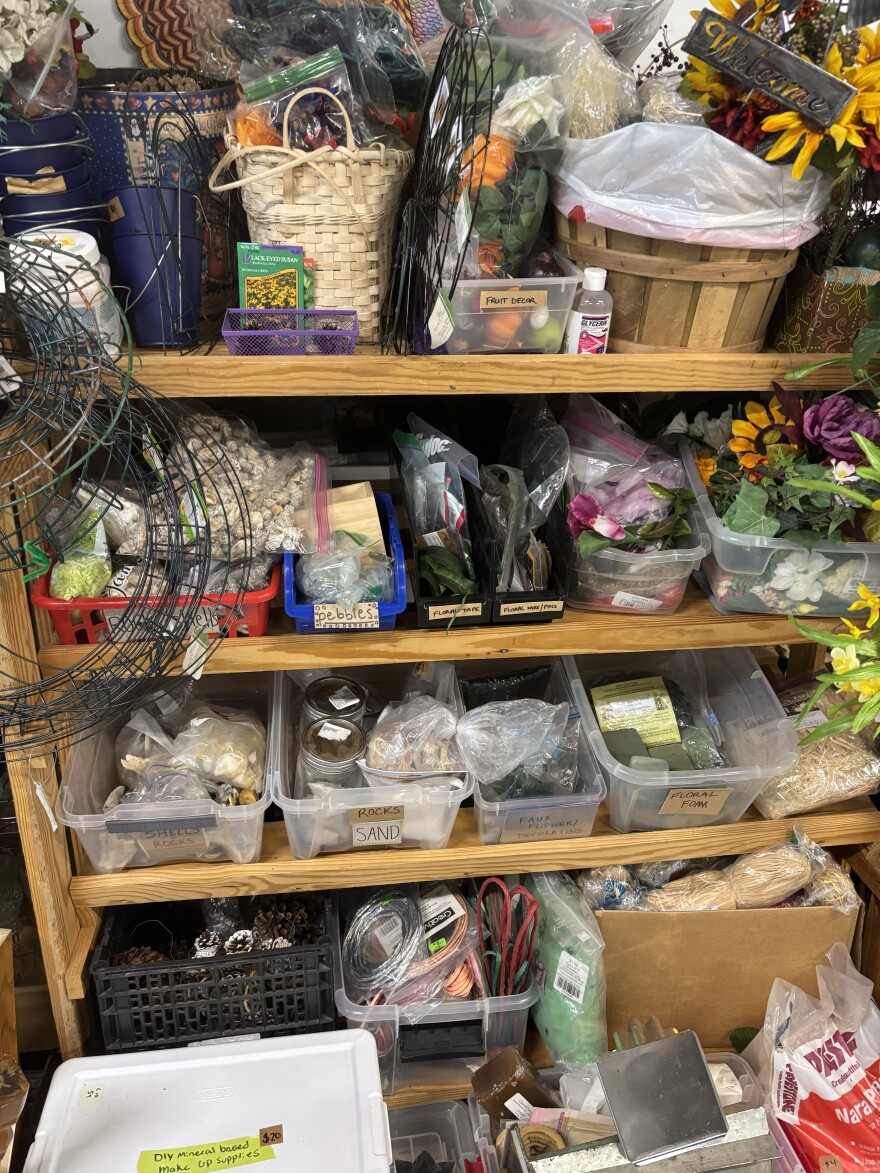 Bins of donated items fill the shelves.