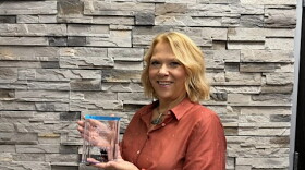 Ray City Auditor Ronda Rustad poses with the North Dakota League of Cities’ Leadership Excellence Award, which recognizes her public service, mentorship and advocacy for small communities.