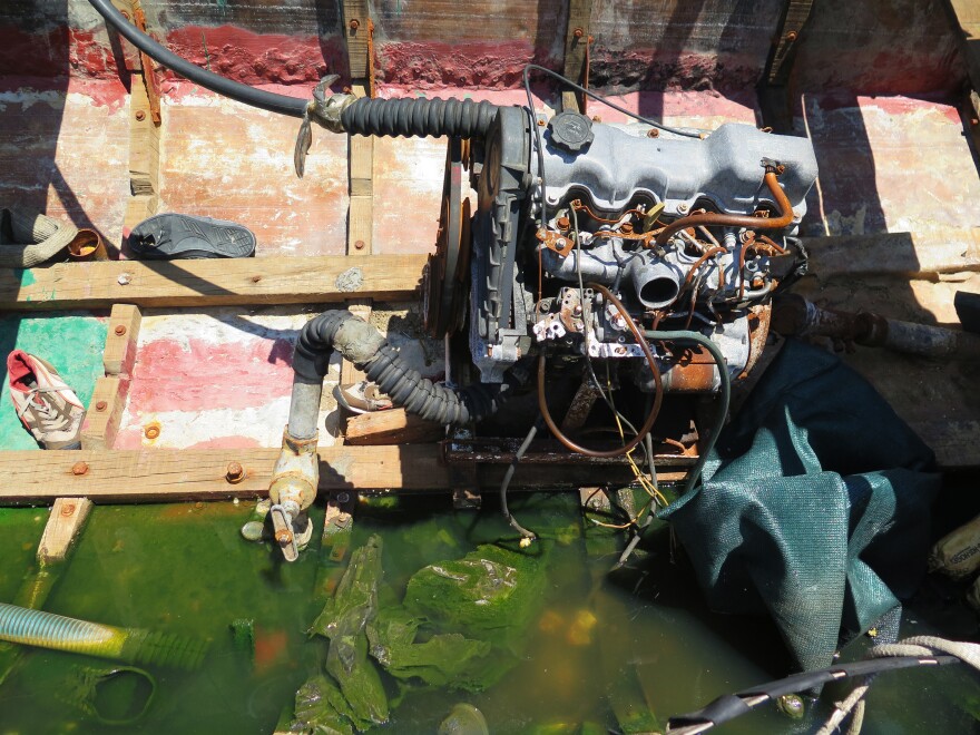The interior of a "chug" shows the engine along with sneakers and other debris from the migrants' trip.