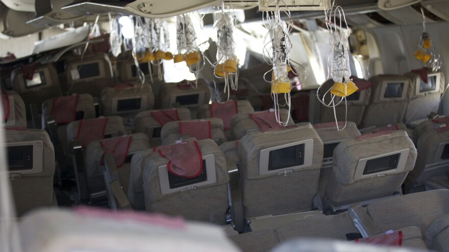 A photo published by the NTSB shows the interior of Asiana Airlines flight 214, which crash-landed at San Francisco's airport Saturday. The investigation into the crash, which killed two people, is continuing.