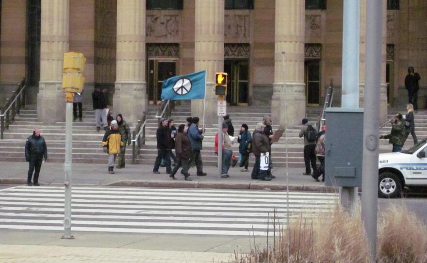 Occupy Buffalo protestors march outside City Hall hours after Buffalo Police evicted protestors from Niagara Square, arresting ten Occupy members.