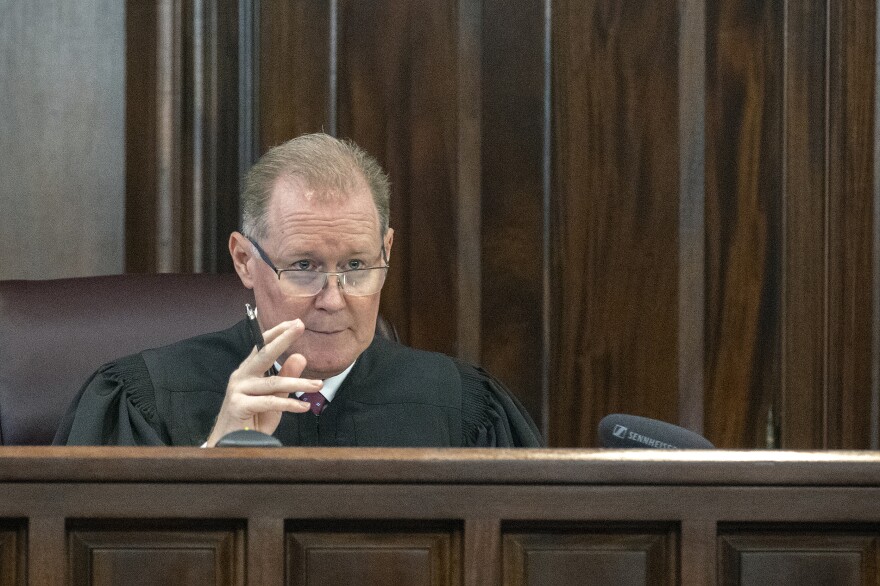 Superior Court Judge Timothy Walmsley responds to arguments during a motion hearing in the trial of Greg McMichael and his son, Travis McMichael, and a neighbor, William "Roddie" Bryan in the Glynn County Courthouse on Thursday.