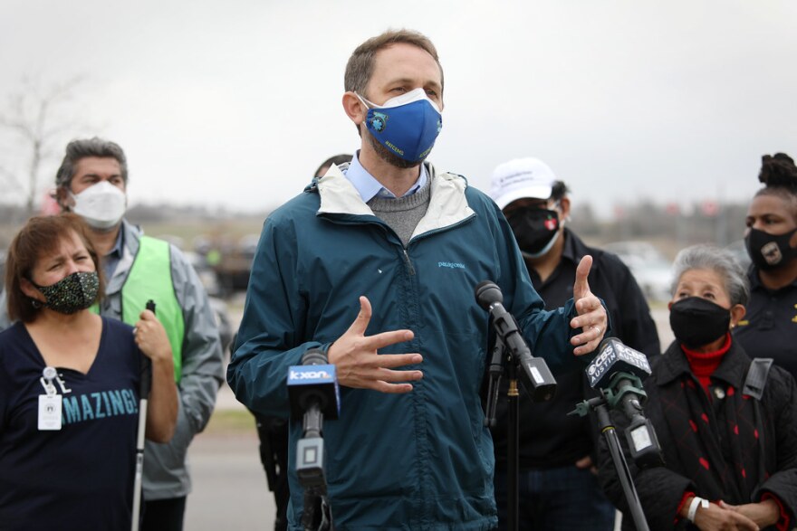 Travis County Judge Andy Brown speaks at the test run of a mass vaccination site at the Circuit of the Americas on Saturday.