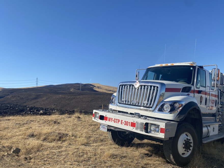 Fire crews tend the Trinity Fire just outside the Tri-Cities on August 14