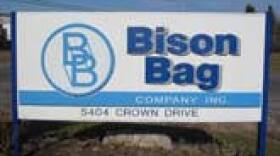 The blue and white Bison Bag sign at the company entrance.