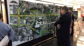 Residents examined section maps of the planned U.S. 74 widening project Tuesday at CPCC in Matthews. 