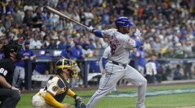 New York Mets' J.D. Martinez hits a two-run scoring single during the fifth inning of Game 2 of a National League wild card baseball game against the Milwaukee Brewers Tuesday, Oct. 1, 2024, in Milwaukee. (AP Photo/Morry Gash)