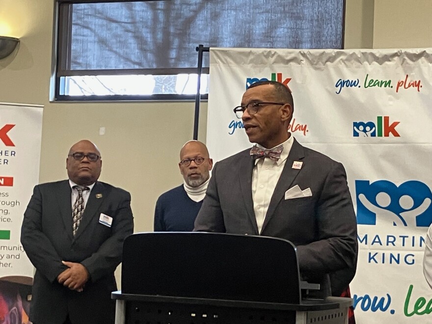 Rev. Dwight Ford, executive director of Project NOW, speaks at Thursday's press conference at the MLK Center, Rock Island.