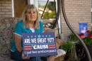 Kathie Jensen sits in the front garden of her West Valley City home, June 12, 2026. She’s tired of the current state of politics and, as a registered Republican, requested a Democratic ballot for the 1st Congressional District primary.