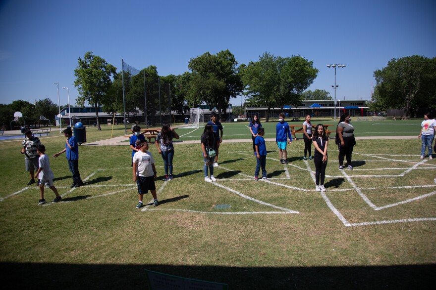 The teen class stands at the ends of their individual lines, which represent a significant point in their life "changed directions".