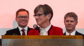 Lt. Gov. David Toland, Gov. Laura Kelly and Chiefs owner Clark Hunt address an excited crowd of roughly 400 people on Dec. 22, 2025, announcing the largest economic deal in Kansas history.