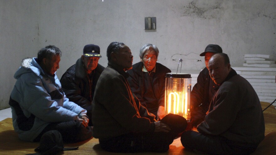 South Korean citizens gather in an underground shelter on Baengnyeong Island Monday, as their country's military began live-fire artillery drills from front-line islands near its disputed sea border with North Korea.