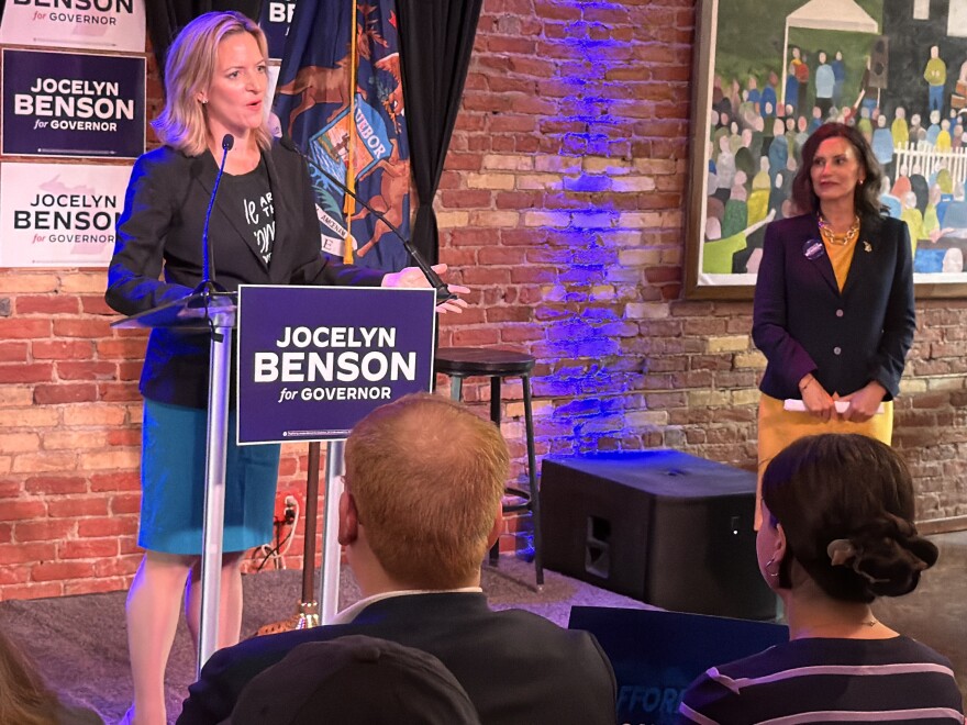 Michigan Secretary of State — and Democratic nominee for governor — Jocelyn Benson speaks at an event the day after the primary election as Governor Gretchen Whitmer looks on.