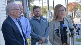 During an October 2025 press conference, Senator Peter Welch (left) listens as Alyssa Black describes how the loss of ACA tax credits would affect her 