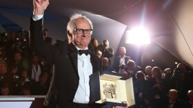 Director Ken Loach poses for photographers with the Palme d'Or for his film "I, Daniel Blake," following the Cannes Film Festival in 2016. (Joel Ryan/AP)