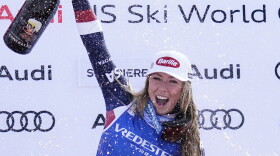 United States' Mikaela Shiffrin celebrates her 100th victory after an alpine ski, women's World Cup slalom, in Sestriere, Italy, Sunday, Feb. 23, 2025. (AP Photo/Piermarco Tacca)