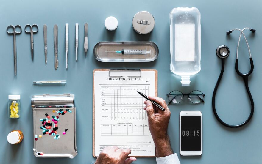 Doctor's office supplies on desk.