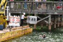 Clark and Clay Lancaster lower the artificial reef into the waters of Lake Norman State Park. 