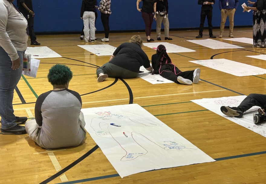 Kids work on self-reflection posters at a ReRoute workshop at the Marion Franklin Center, located at 2801 Lockbourne Road.